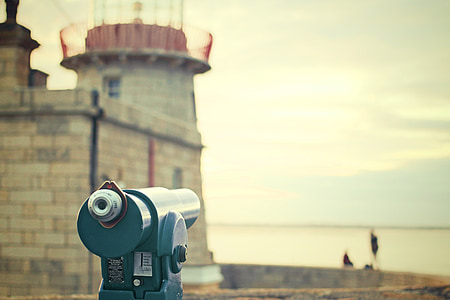 closeup photo telescope near castle thumbnail