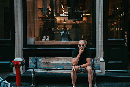 man sitting on bench thumbnail