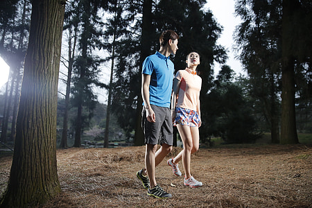 man and woman walking outdoors thumbnail