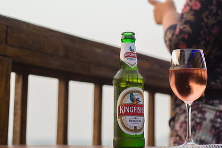 King fisher bottle beside wine glass thumbnail