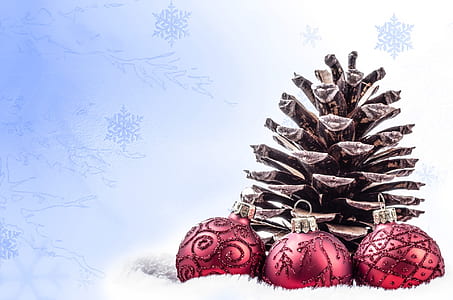 pine cone and three baubles on snow wallpaper thumbnail