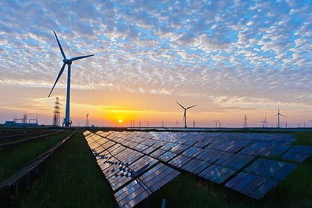 windmills near solar panel boards thumbnail