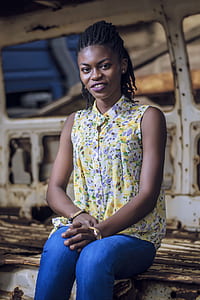 woman sitting inside in abandon vehicle thumbnail