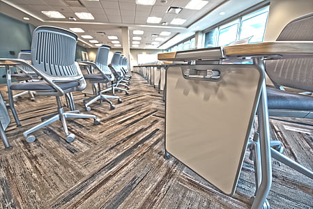 gray rolling armchair near table thumbnail