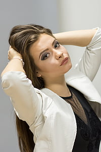 woman holding her hair while taking photo thumbnail