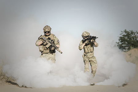 men wearing military uniform holding assault rifle during daytime thumbnail