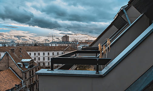 gray and black concrete house during daytime thumbnail