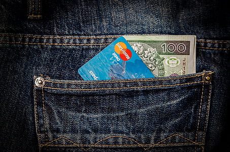 closeup photo of 100 banknote and MasterCard debit card thumbnail