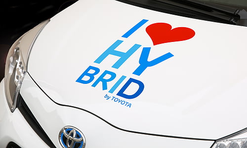 white Toyota Auris with I love HY Brid text on hood thumbnail