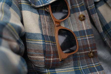 brown sunglasses on plaid shirt thumbnail