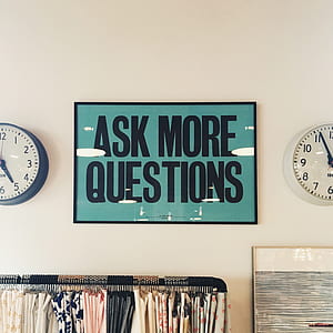 round blue and white analog wall clocks mounted on wall thumbnail