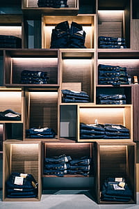 denim bottoms in brown wooden shelf thumbnail