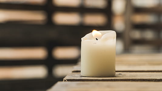 white flameless candle on board thumbnail