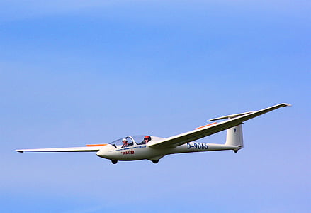 people riding on white plane thumbnail
