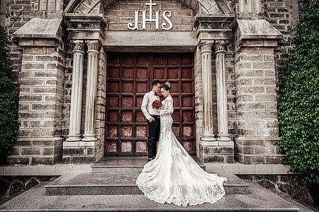 bride wearing with groom white flower lace long-sleeved floor length wedding gown thumbnail