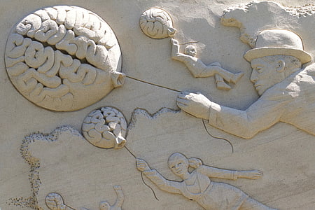 people holding balloon embossed wall during daytime thumbnail