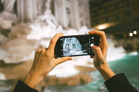 Taking a photo of Trevi Fountain thumbnail