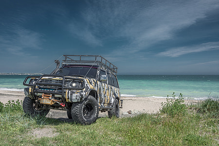 off-road car near seashore thumbnail