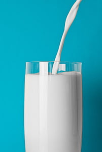 milk pouring in white drinking glass thumbnail