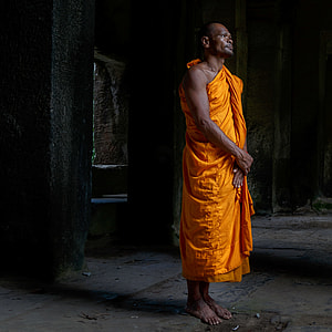 monk standing in front of wall thumbnail