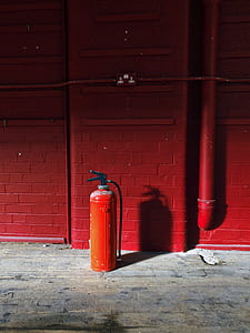 red fire extinguisher on the floor thumbnail