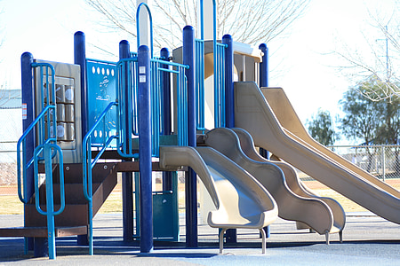 blue and white slide on playground during daytime thumbnail