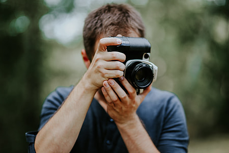 Photographer taking photos of a beautiful, young woman thumbnail