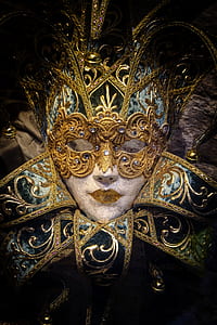 low light photography of gold mask thumbnail