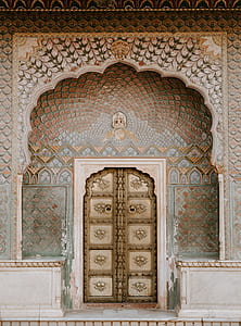 concrete archway leading to closed door thumbnail