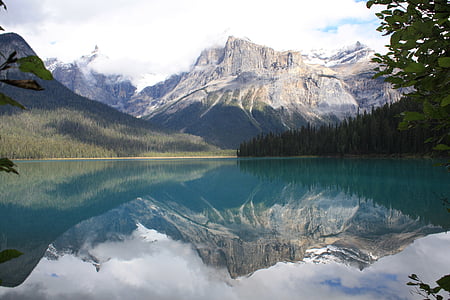 mountain and body of water during daytime thumbnail