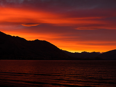 body of water during sunset thumbnail