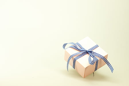 beige gift box with black and white ribbon thumbnail