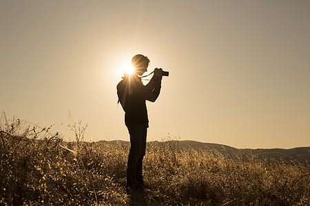 silhouette of man taking a picture thumbnail