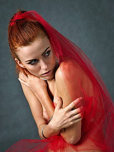 woman wearing red mesh veil thumbnail