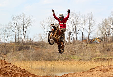 man riding on motocross dirt bike thumbnail