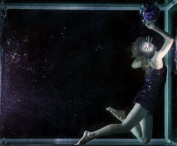 woman holding tabletop clock thumbnail