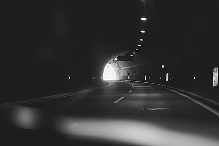 grayscale photography of tunnel thumbnail