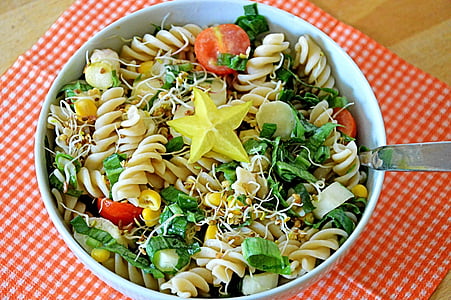 pasta with vegetables in round white ceramic bowl thumbnail