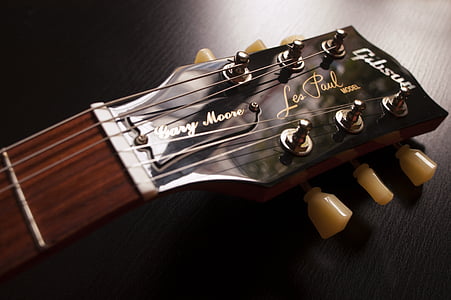 brown wooden guitar headstock thumbnail