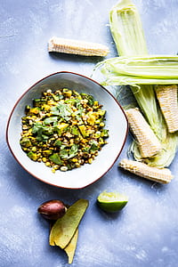 vegetable salad with corns in white bowl thumbnail