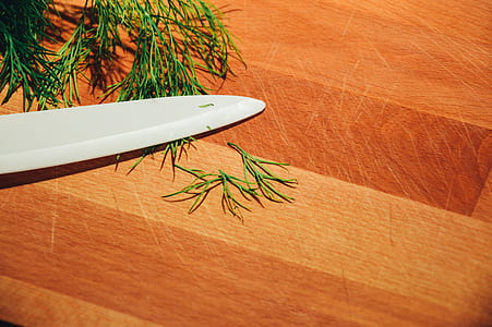 utility knife on top of brown table thumbnail