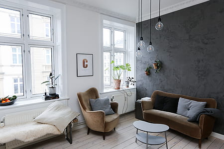 brown sofa set with coffee table near window thumbnail