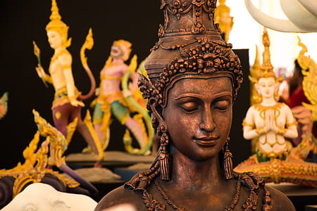 Buddha statuette in closed-up photo thumbnail