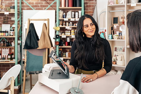 Merchant Showing Customer Pos Ipad Photo thumbnail