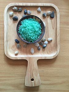 pebbles on brown wooden trayu thumbnail
