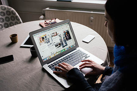 Girl is browsing Pinterest on her MacBook Air thumbnail