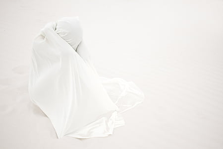 person covered with white textile thumbnail