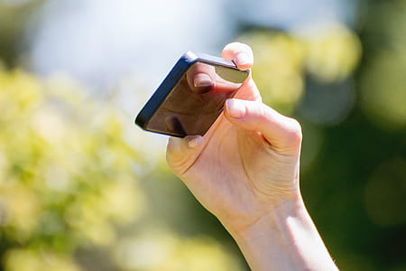 Female hand using a smartphone. Shallow depth of field thumbnail