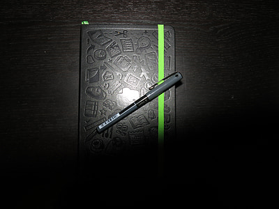 gray and black ballpoint pen on black labeled book thumbnail