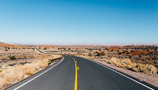 empty asphalt road during daytime thumbnail
